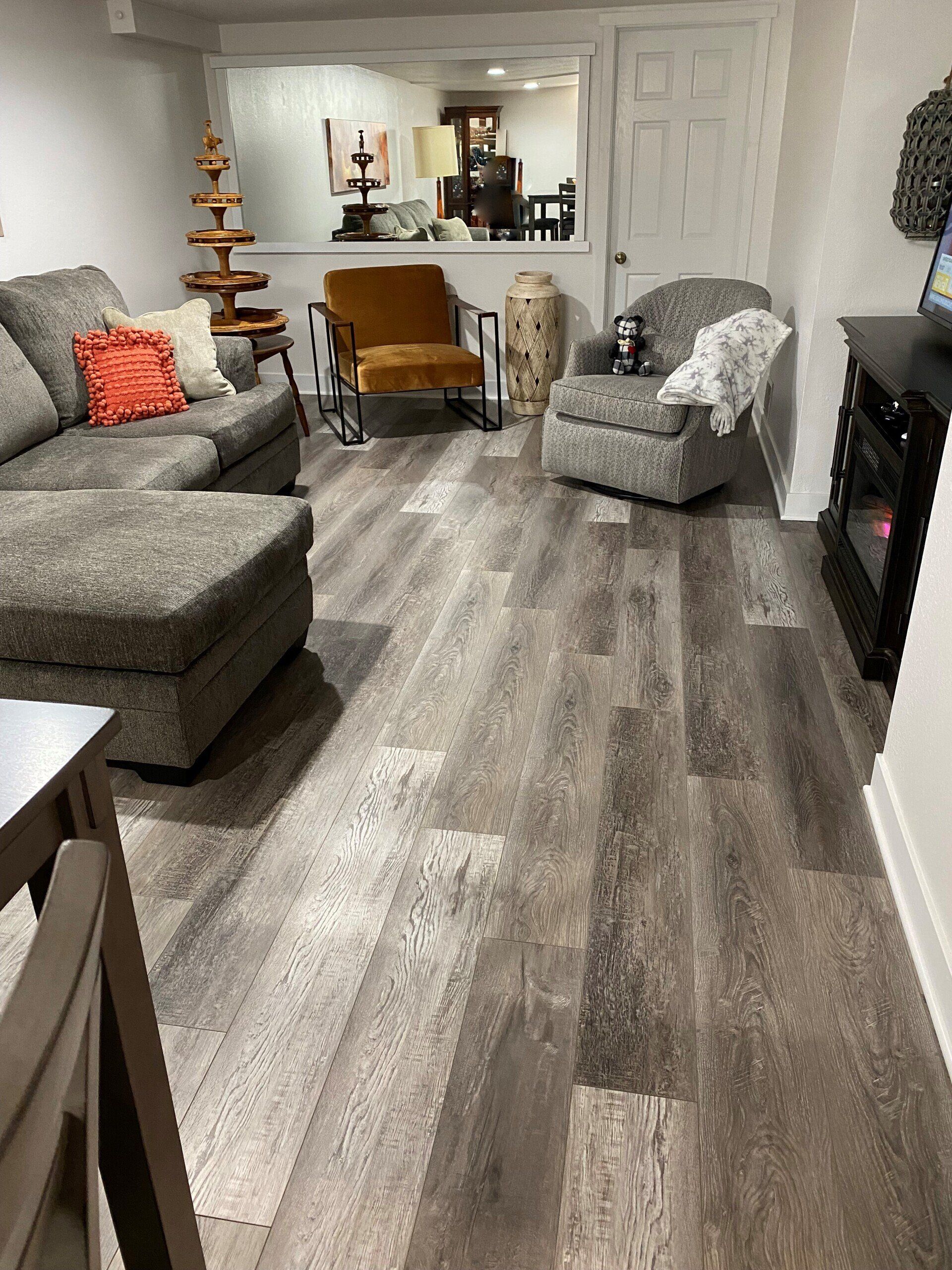 A living room filled with furniture and a fireplace.