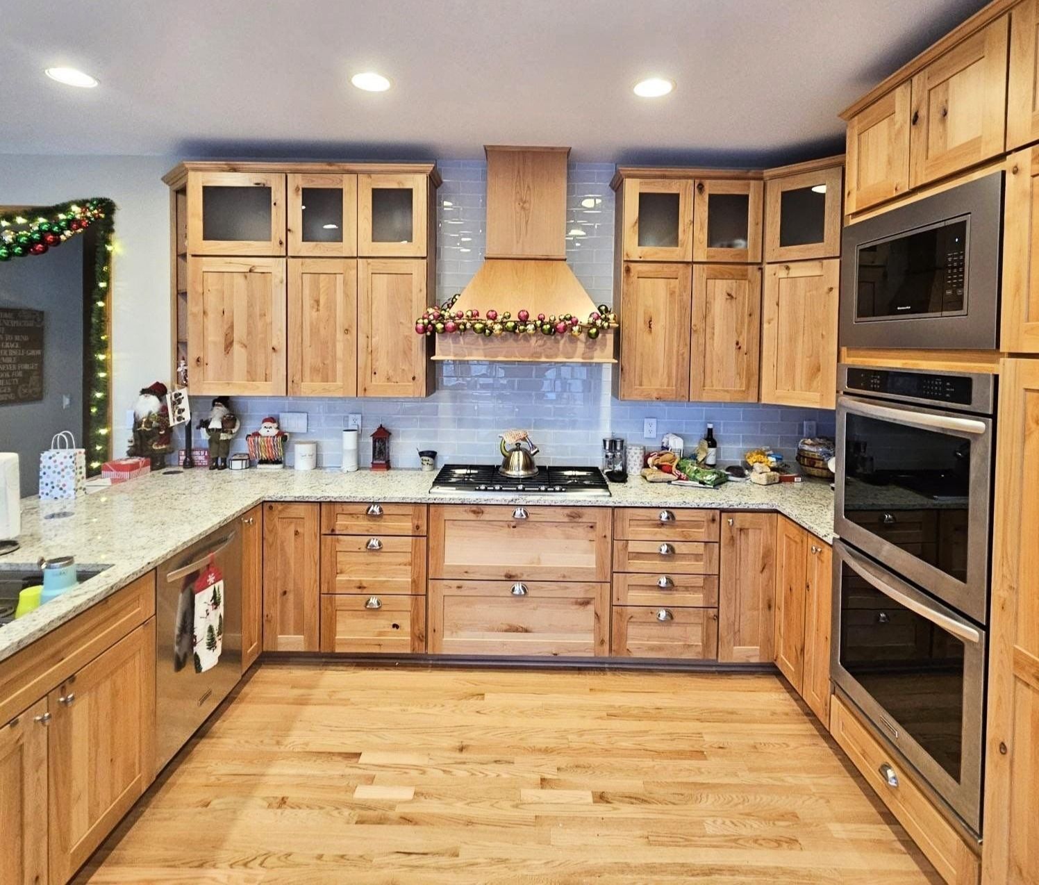 A kitchen with wooden cabinets and stainless steel appliances