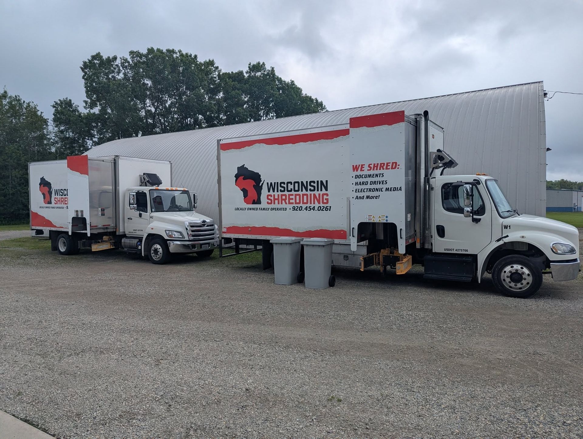 Two white trucks with 