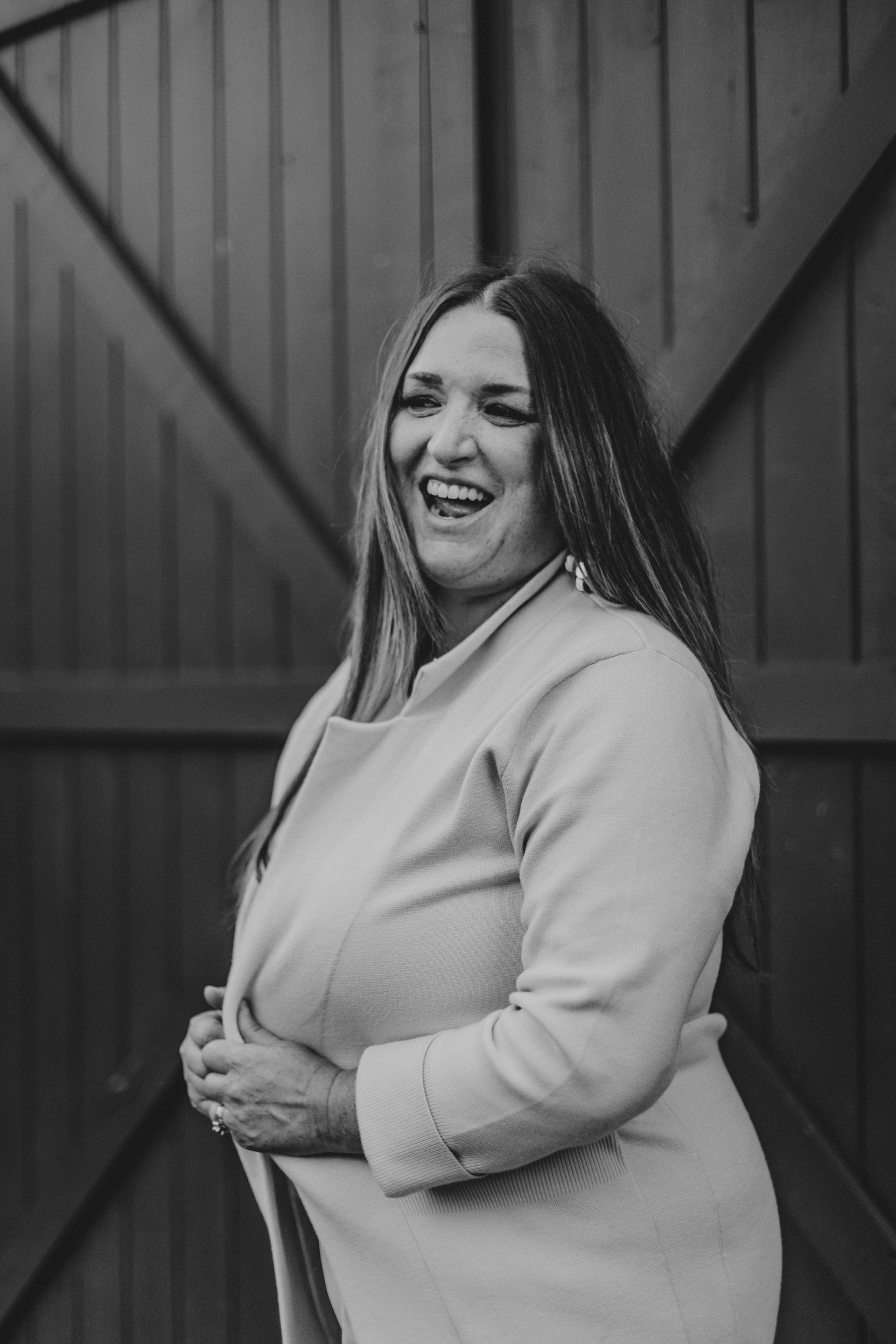 A woman is sitting in a chair in a salon.