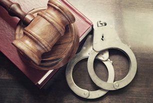 Gavel, book and handcuffs