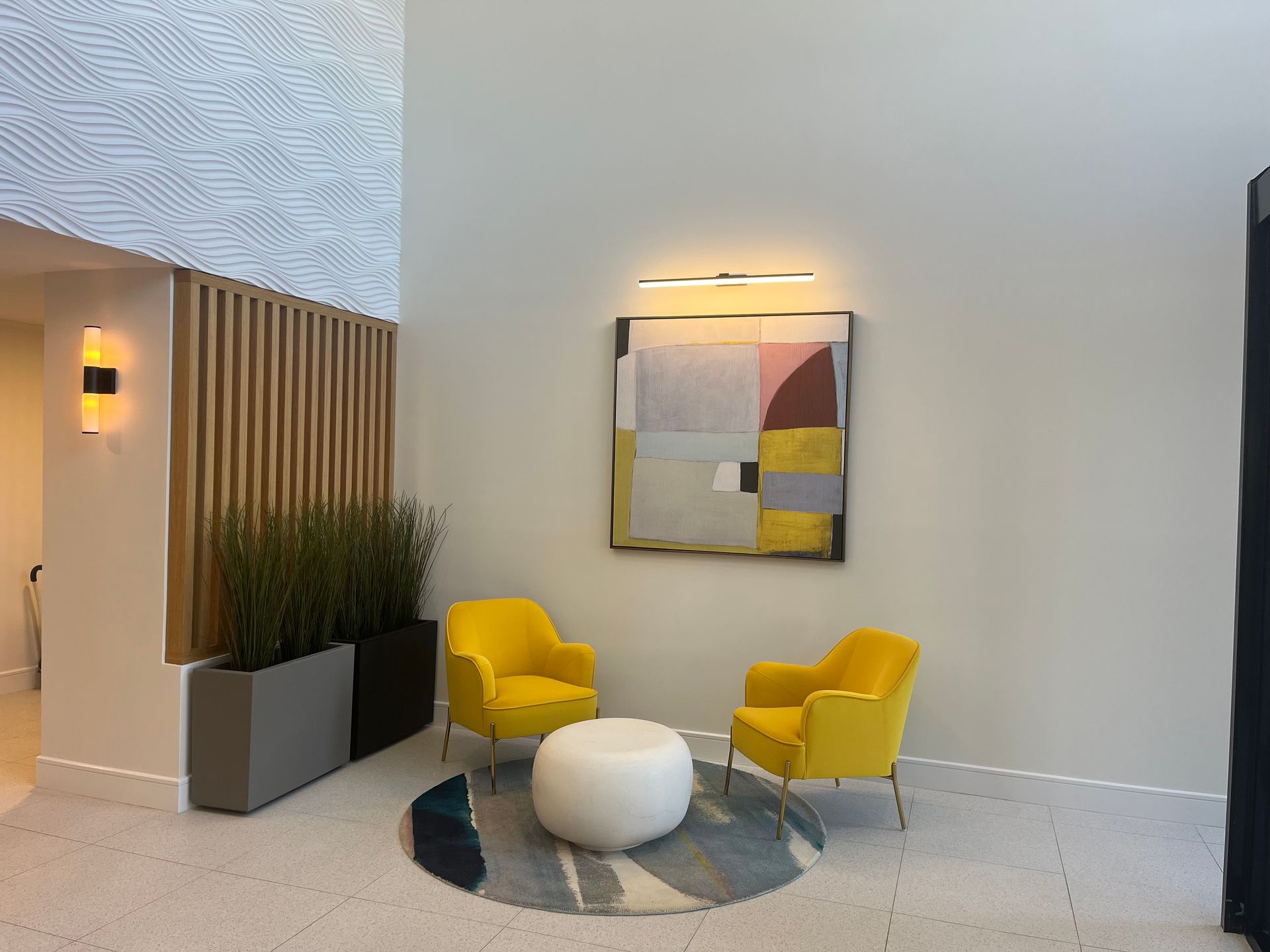 Group of people in front of a yellow 