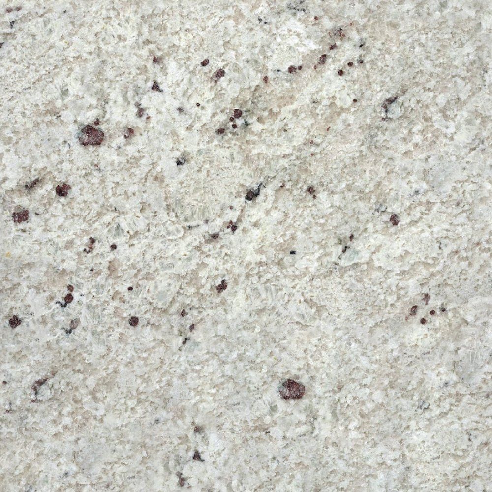 Light-colored granite countertop with small, dark reddish-brown flecks scattered throughout the stone.