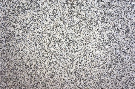 Gray granite surface with small, speckled textures.
