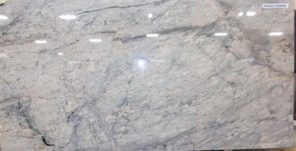 Large slab of light gray and white granite with dark gray veining.