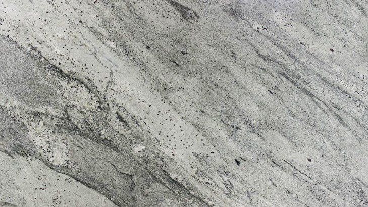 Gray and white granite with swirled patterns and speckles.