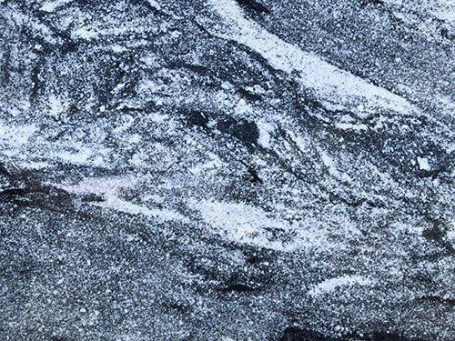 Gray and white marbled stone texture.