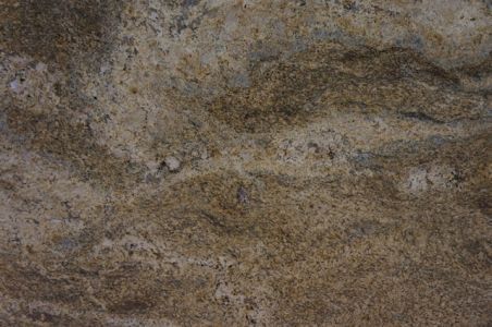 Brown granite surface with swirling patterns and variations in texture.