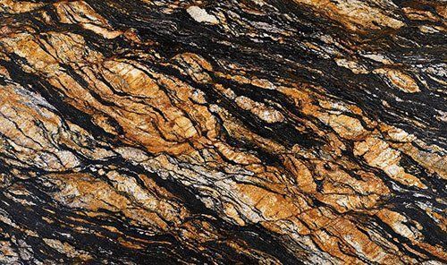 Swirled granite surface, with bands of black, gold, and white.