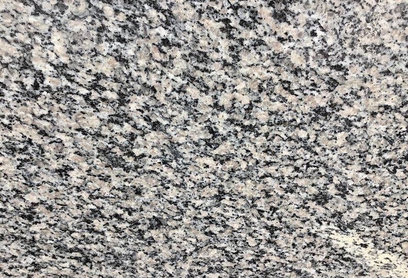 Gray granite surface with black and white specks.