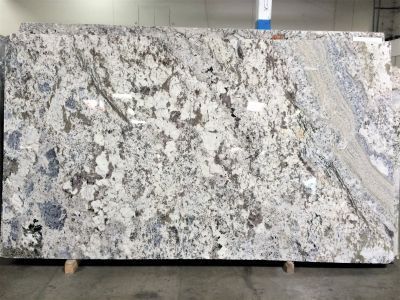 Large slab of granite with a white, blue, and brown marbled pattern.