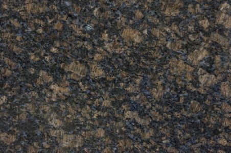 Dark speckled granite with brown, gray, and blue flecks.