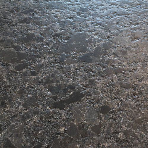 Textured dark gray and black granite countertop.