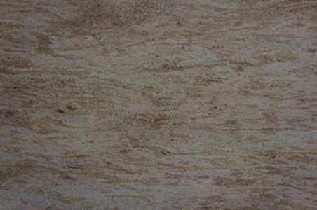 Sand-colored texture with brown wavy lines and small dark specks.