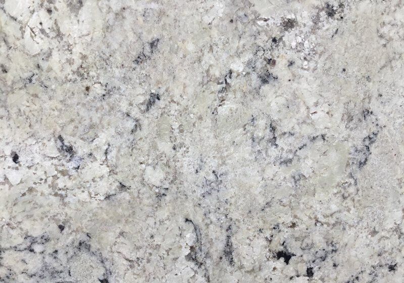 Close-up of a granite countertop. White, gray, and black speckled pattern.