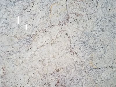 Light-colored granite countertop with gray, brown, and white veining.