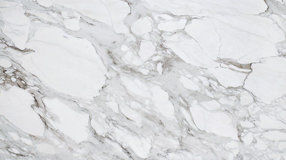 White marble countertop with gray veining.