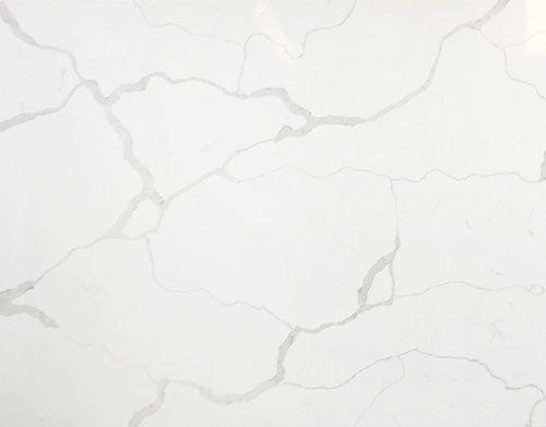 White countertop with grey veining, resembling marble.