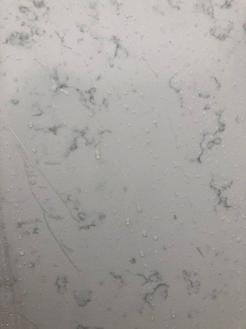 White countertop with gray veining.