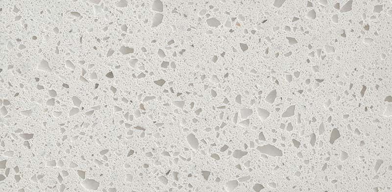 White quartz countertop with speckled patterns.