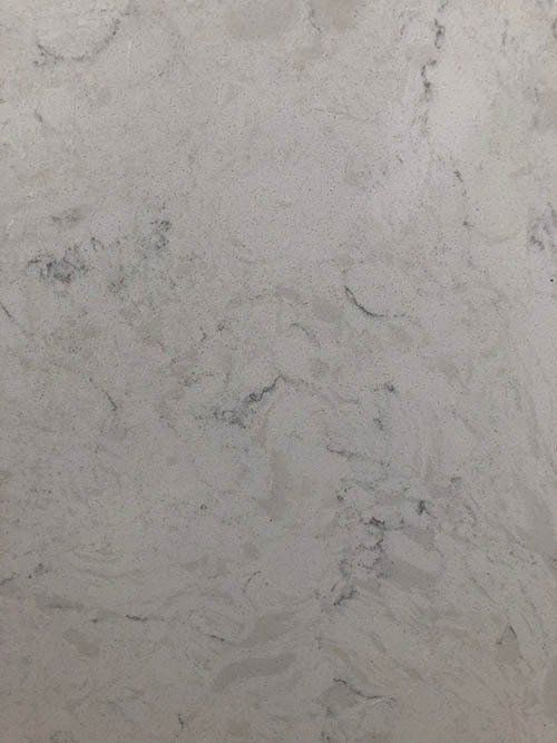 White countertop with subtle gray veining and hints of blue.