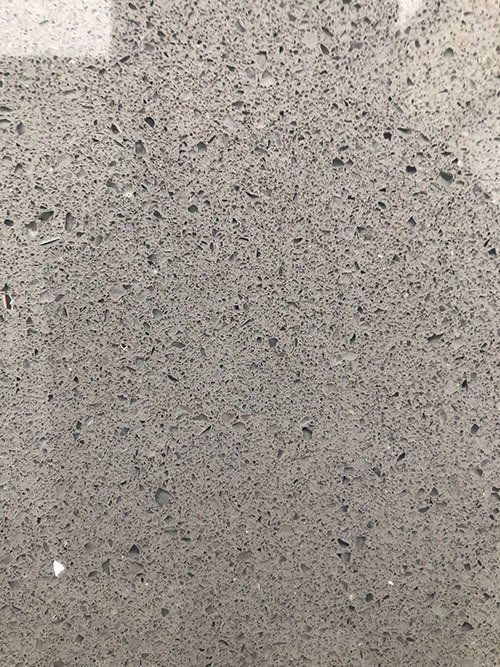 Gray speckled stone surface.