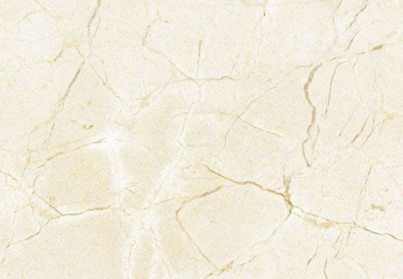 Cream-colored marble texture with light brown veins and cracks.