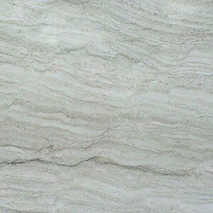Light-colored stone with wavy, greyish patterns.