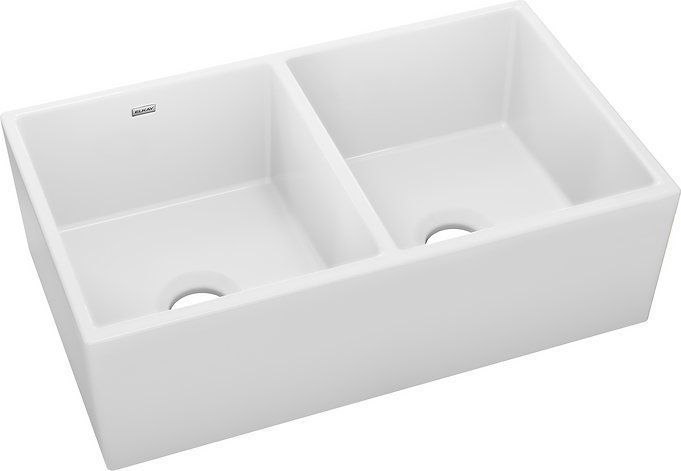 White double-basin farmhouse sink with two openings, rectangular shape, angled view.