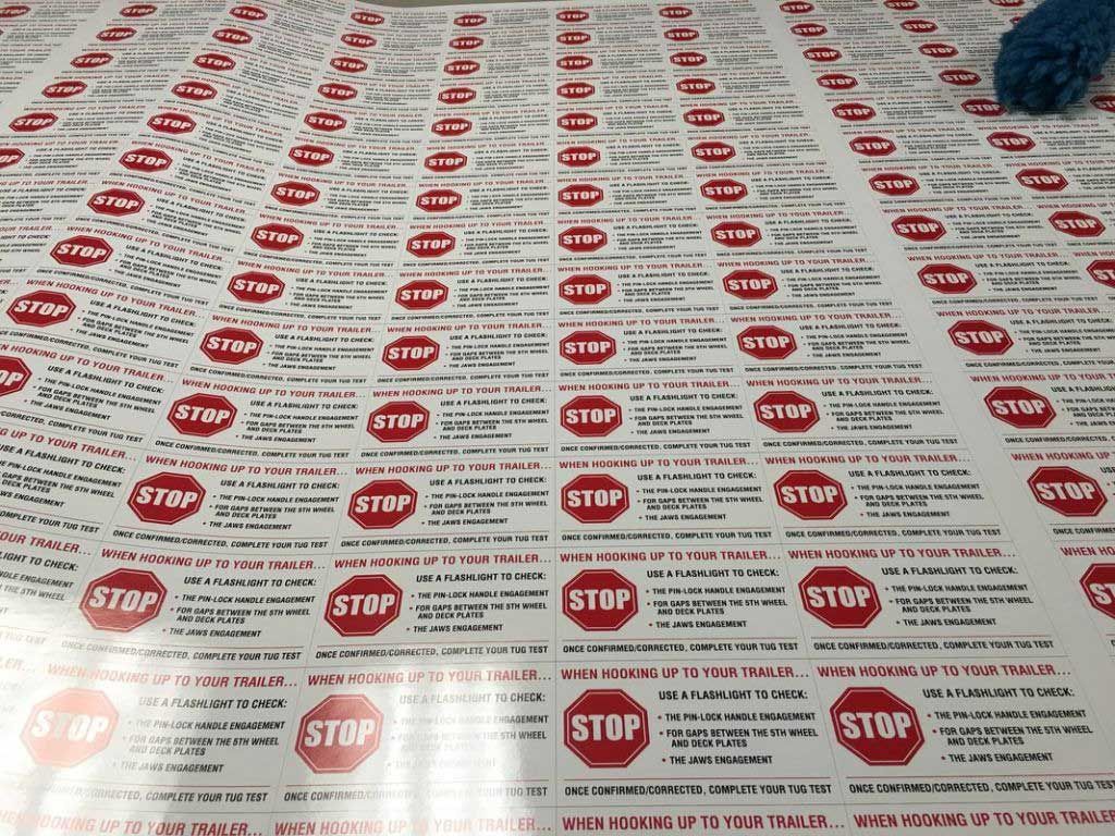 Sheet of stickers, each with a red