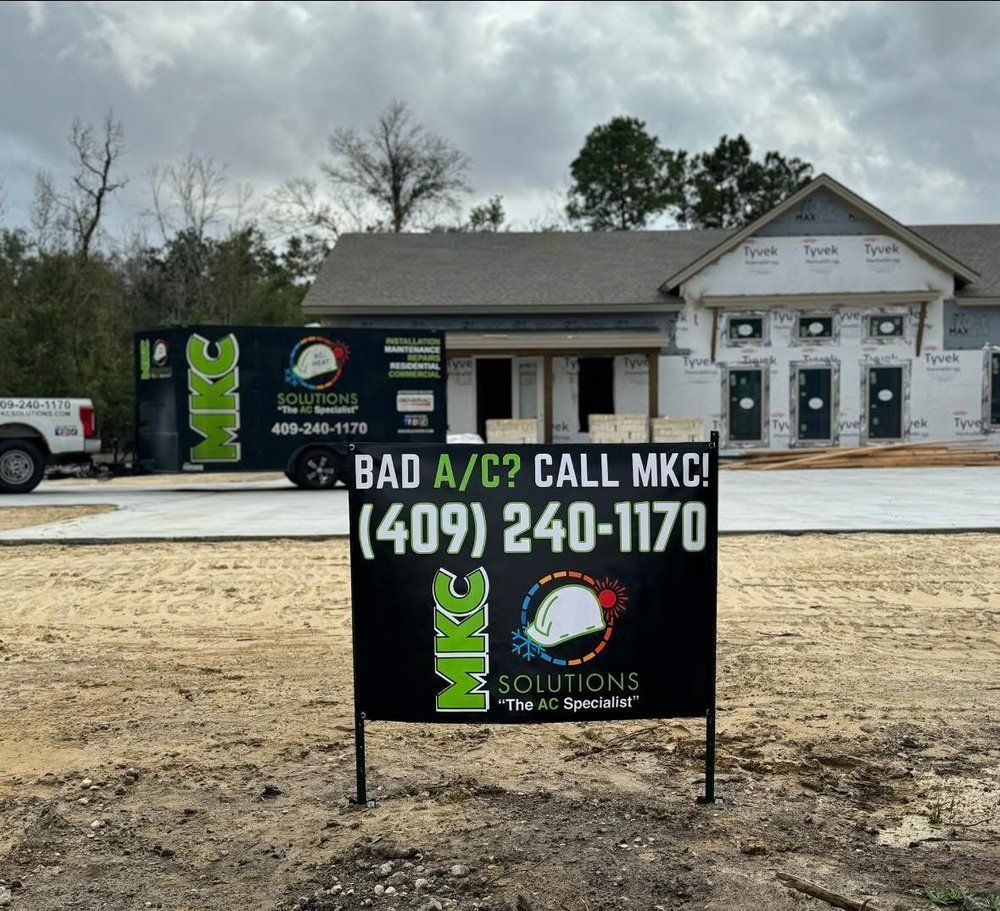 A sign in front of a house that says bad a / c call mkc