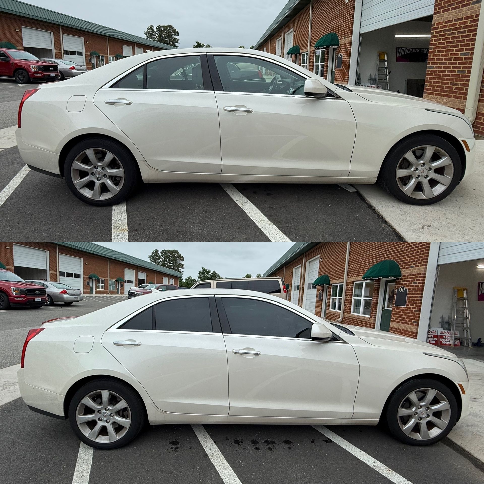 White sedan parked diagonally in a lot beside brick storefronts, shown in side profile from two angles.