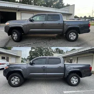 Two side views of a gray pickup truck parked beside a garage, shown in a driveway.