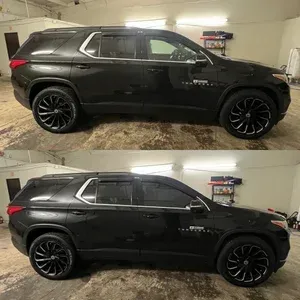 Black SUV parked in a garage, shown twice in side view.