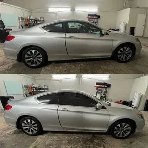 Silver coupe parked in a garage, shown in side profile from two angles.