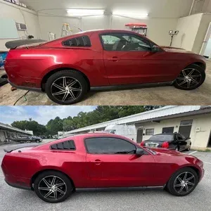 Red coupe shown indoors and outdoors, with tinted windows and black rims.