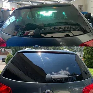Rear view of a black SUV, showing a tinted rear window before and after cleaning or tinting.