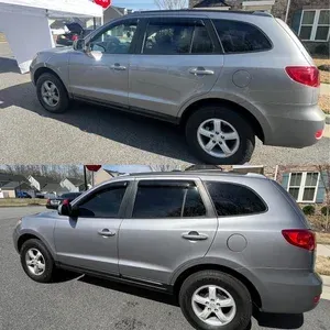 Silver SUV shown in side view, with rear and front views in a parking lot.