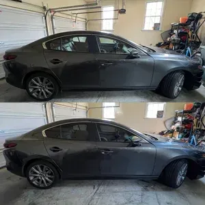 Dark gray sedan parked in a garage, shown from the side in two stacked photos.