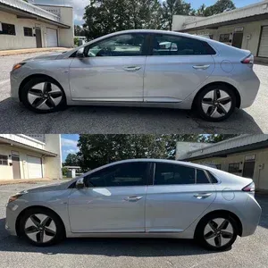 Silver sedan parked in a driveway, shown in side profile from two slightly different angles.