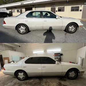 White sedan shown in side view outdoors and in a garage, with aftermarket wheels and tinted windows