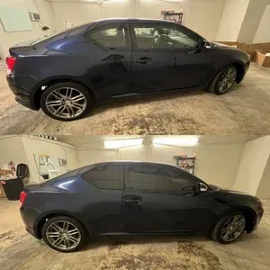 Black sedan parked in a garage, shown from the side in two stacked views.