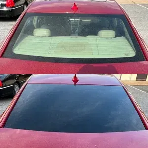 Red car windshield before and after cleaning, showing dirt removed from glass
