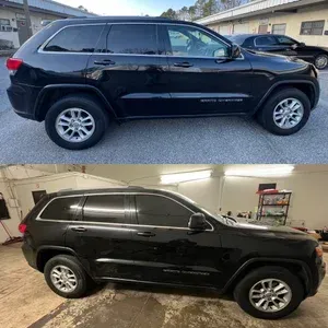 Black SUV shown in side view outdoors and inside a garage, with tinted windows and silver wheels