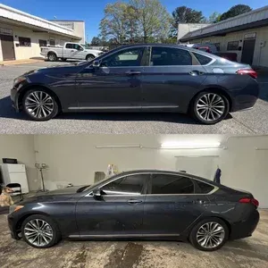 Dark gray sedan shown in side profile, outdoors above and inside a garage below.