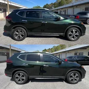 Black SUV parked outdoors, shown in side view from two angles under bright daylight.