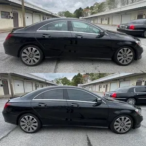 Black sedan parked in a lot, shown in side view from two slightly different angles.
