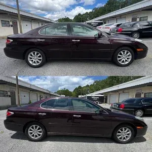 Dark maroon sedan parked in a lot, shown in side profile from slightly different angles.