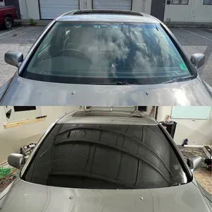 Two views of a silver car, front exterior and windshield reflection in a garage-like setting