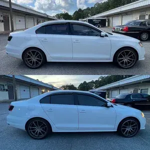 White sedan parked in a residential driveway, shown in side view from two similar angles.
